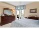 Primary bedroom with balcony access, dresser and serene decor at 9630 Club South Cir # 6208, Sarasota, FL 34238