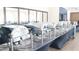 Buffet area with covered warming trays atop an elegant display table with a decorative black tablecloth at 9630 Club South Cir # 6208, Sarasota, FL 34238