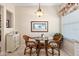 Cozy breakfast nook features glass table and beach-themed decor at 9630 Club South Cir # 6208, Sarasota, FL 34238
