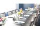 Elegantly set dining table with fresh floral arrangements, napkins, and silverware, ready for service at 9630 Club South Cir # 6208, Sarasota, FL 34238