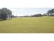 Expansive golf course with lush green fairway and scattered trees, offering a scenic view of the community at 9630 Club South Cir # 6208, Sarasota, FL 34238