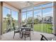 Relaxing lanai with seating, providing a serene space to enjoy the beautiful outdoor views and sunshine at 9630 Club South Cir # 6208, Sarasota, FL 34238