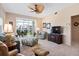 Inviting living room with comfortable seating, ceiling fan, and a view of the screened-in lanai at 9630 Club South Cir # 6208, Sarasota, FL 34238