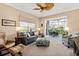 Bright living room with cozy furniture and a large window showcasing outdoor scenery, perfect for relaxation at 9630 Club South Cir # 6208, Sarasota, FL 34238