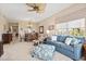 Open-concept living and dining area, featuring stylish furniture, a ceiling fan, and great natural light at 9630 Club South Cir # 6208, Sarasota, FL 34238