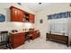 Home office includes custom desk, shelving and natural light at 9630 Club South Cir # 6208, Sarasota, FL 34238