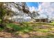 Expansive backyard featuring ample space and a partially covered patio area at 1004 12Th W Ave, Palmetto, FL 34221
