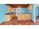 Classic kitchen features tiled countertops, custom cabinetry, and convenient layout at 1004 12Th W Ave, Palmetto, FL 34221