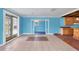 Inviting living room flows into an adjacent kitchen and sunroom area at 1004 12Th W Ave, Palmetto, FL 34221