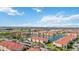 Expansive community view with multiple residences, lakes, amenities, and scenic landscaping at 1005 Villagio Cir # 106, Sarasota, FL 34237