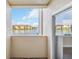 Balcony view overlooking a beautiful lake and residential buildings for tranquil scenery at 1005 Villagio Cir # 106, Sarasota, FL 34237