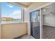 Enjoy serene water views from this condo's balcony with sliding glass doors leading to a living space at 1005 Villagio Cir # 106, Sarasota, FL 34237