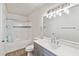 Beautiful bathroom featuring a shower-tub combo, vanity, and modern fixtures at 1005 Villagio Cir # 106, Sarasota, FL 34237