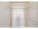 Walk-in closet featuring laminate floors and wire shelving at 1005 Villagio Cir # 106, Sarasota, FL 34237