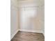 Walk-in closet featuring laminate floors and wire shelving at 1005 Villagio Cir # 106, Sarasota, FL 34237