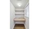 Efficient office nook featuring built-in desktop and shelving at 1005 Villagio Cir # 106, Sarasota, FL 34237