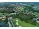 Aerial image featuring scenic golf course, with ponds, lush foliage, and winding roads at 10509 Winding Stream Way, Bradenton, FL 34212