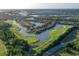Magnificent aerial view of golf community with waterfront homes, scenic waterways and lush landscaping at 10509 Winding Stream Way, Bradenton, FL 34212