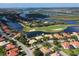 Picturesque aerial view of a beautiful waterfront neighborhood, featuring lush landscapes at 10509 Winding Stream Way, Bradenton, FL 34212