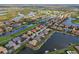 Beautiful aerial view of homes on the water, showcasing private boat docks at 10509 Winding Stream Way, Bradenton, FL 34212