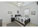 Comfortable bedroom with neutral tones, a cozy bed, and natural light from the window at 10509 Winding Stream Way, Bradenton, FL 34212