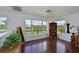 Bonus room featuring hardwood floors and a scenic view of the pond at 10509 Winding Stream Way, Bradenton, FL 34212