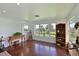 Bonus room with hardwood floors and picturesque lake views, perfect for relaxation at 10509 Winding Stream Way, Bradenton, FL 34212