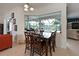 Cozy breakfast nook with views of the pool and outdoor living area at 10509 Winding Stream Way, Bradenton, FL 34212