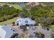 An aerial image showcases the inviting clubhouse, along with parking and golf cart access at 10509 Winding Stream Way, Bradenton, FL 34212