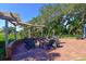 Inviting outdoor fire pit area with comfortable seating and a pergola, perfect for relaxing at 10509 Winding Stream Way, Bradenton, FL 34212