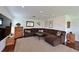 Spacious living room featuring plush seating, a large area rug, and warm, inviting decor at 10509 Winding Stream Way, Bradenton, FL 34212