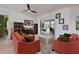 Inviting living room with comfortable seating and seamless access to the outdoor patio at 10509 Winding Stream Way, Bradenton, FL 34212