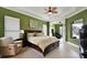 Spacious main bedroom with tray ceilings, large windows, and elegant columns at 10509 Winding Stream Way, Bradenton, FL 34212