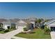 Beautiful aerial shot of this lovely home featuring a two-car garage and manicured landscaping at 10914 Blue Magnolia Ln, Parrish, FL 34219