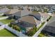 Aerial view of a fenced yard with a screened in pool, umbrella and seating at 10914 Blue Magnolia Ln, Parrish, FL 34219