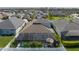 Aerial view of a backyard pool with a screened enclosure, surrounded by lush green landscaping at 10914 Blue Magnolia Ln, Parrish, FL 34219