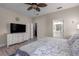 Serene bedroom with a walk-in closet, adjoining bathroom, and soothing decor at 10914 Blue Magnolia Ln, Parrish, FL 34219