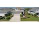 Well-maintained exterior view of a two-story home with a neatly landscaped front yard and a two-car garage at 10914 Blue Magnolia Ln, Parrish, FL 34219