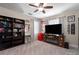 Relaxed Gathering room with entertainment center, bookshelves, a TV, and comfortable seating at 10914 Blue Magnolia Ln, Parrish, FL 34219
