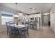 Eat in kitchen with stainless steel appliances, tile floors, breakfast bar and dining table at 10914 Blue Magnolia Ln, Parrish, FL 34219