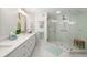 Bright bathroom with a spacious shower and a long vanity, exuding a spa-like ambiance at 121 Tidy Island Blvd, Bradenton, FL 34210