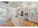 Bright kitchen featuring an island cooktop and a breakfast nook at 121 Tidy Island Blvd, Bradenton, FL 34210