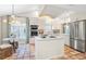 Modern kitchen with stainless steel appliances and a central island at 121 Tidy Island Blvd, Bradenton, FL 34210