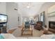 Open-concept living room with fireplace and dining area at 121 Tidy Island Blvd, Bradenton, FL 34210