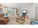 Bright living room featuring built-in shelving and access to the outdoors at 121 Tidy Island Blvd, Bradenton, FL 34210
