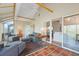 Cozy sunroom with ample seating, terracotta floors and access to an outdoor patio at 121 Tidy Island Blvd, Bradenton, FL 34210