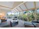 Inviting sunroom with large windows offering scenic views of the surrounding greenery at 121 Tidy Island Blvd, Bradenton, FL 34210