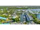 Aerial view of waterfront townhomes with boat docks and lush mangrove estuaries at 1249 Dockside Pl # 110, Sarasota, FL 34242
