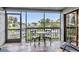 Relax on the screened balcony with views of the lush landscaping and community waterway at 1249 Dockside Pl # 110, Sarasota, FL 34242