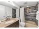 Functional bathroom with a granite countertop, a bathtub-shower combination, and well-maintained fixtures at 1249 Dockside Pl # 110, Sarasota, FL 34242